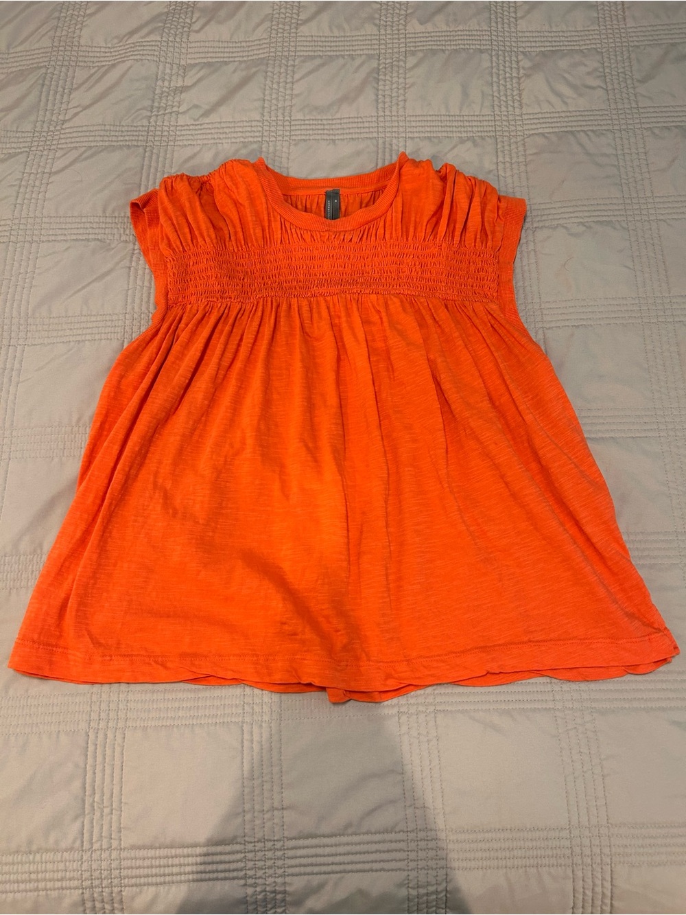 Woman’s Orange Smocked Yoke Top